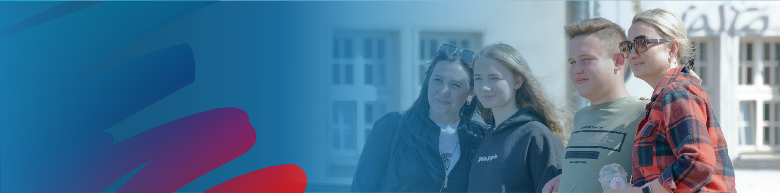 family-of-four-two-parents-and-two-kids-with-lakehead-public-schools-blue-and-rainbow-logo