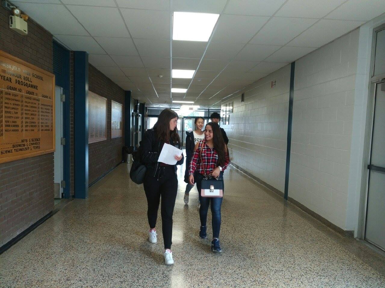 students-walking-through-hammarskjold-high-school-hallway