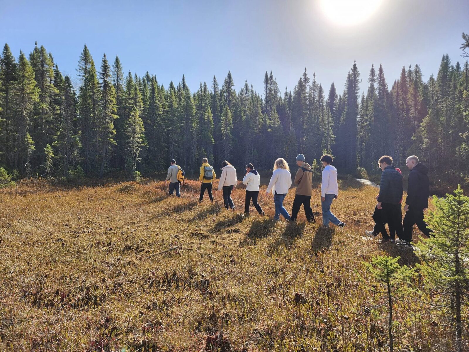 students-walking-through-trails-at-king-fisher