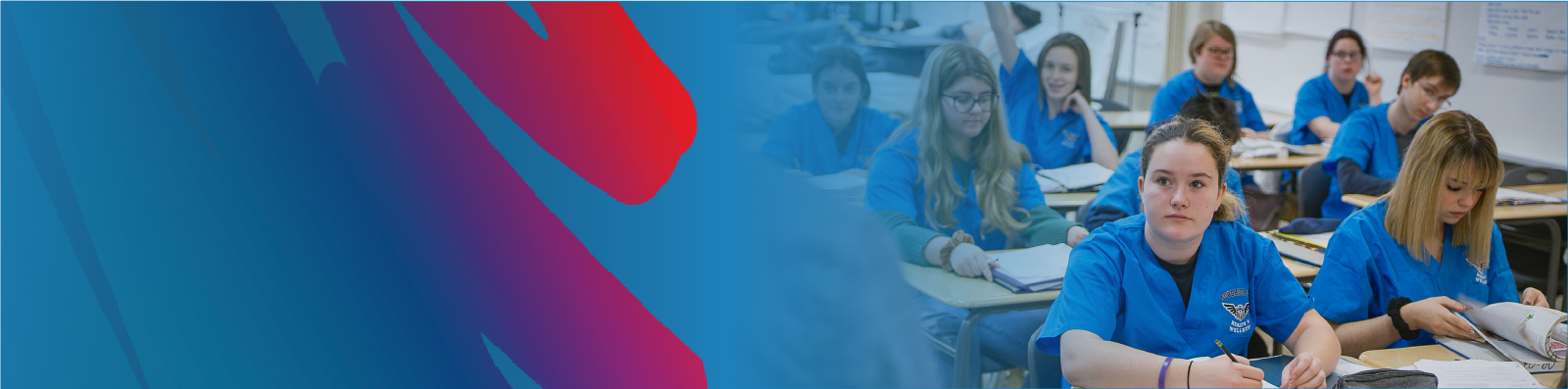 sample-semester-hero-of-students-at-desk-in-class-wearing-blue-scrubs-with-lakehead-public-schools-blue-and-rainbow-logo