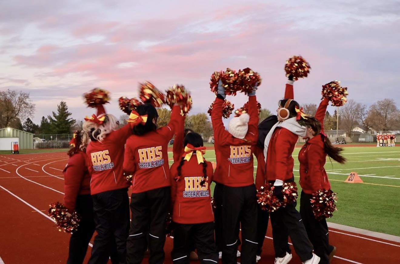 group-of-hammarskjold-cheerleading-students-at-football-game