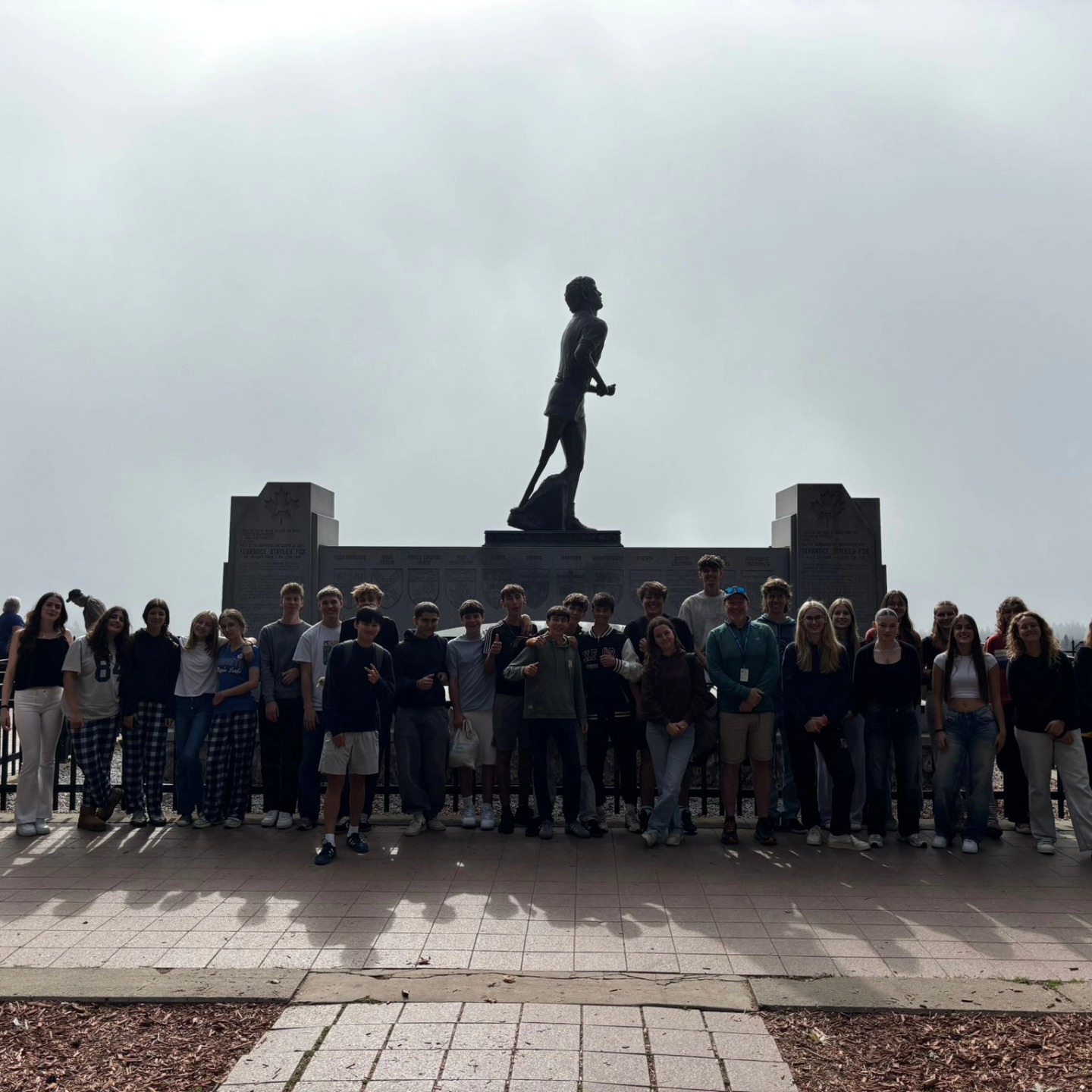 group-of-international-students-standing-in-front-of-the-terry-fox-monument-in-thunder-bay