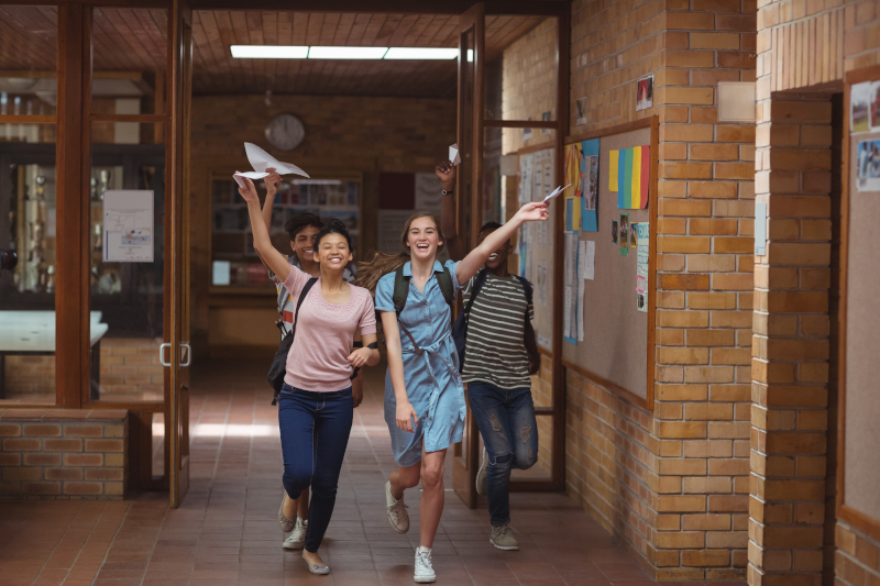 four-students-walking-in-hall