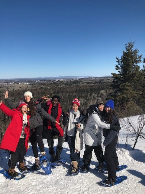 group-of-students-snowshoeing